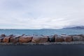 Big brown rocks and stones on the seashore on a moody cloudy day Royalty Free Stock Photo