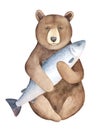 Big brown watchful bear character portrait holding huge gray fish.