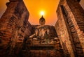 Big Buddha at sunset in Wat Mahathat temple, Sukhothai Historical Park, Thailand