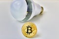 Big bulb & bitcoin money Royalty Free Stock Photo