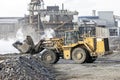 The big bulldozer and industrial pollution. Pollution is the introduction of contaminants into the natural environment that cause Royalty Free Stock Photo