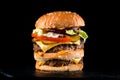 Big burger with double beef cutlet, cheese and vegetable salad Royalty Free Stock Photo