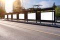 Big bus stop in a modern city with blank advertising banners inside Royalty Free Stock Photo