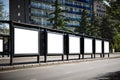 Big bus stop in a modern city with blank advertising banners inside