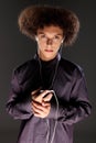 Big bushy afro hair teenager listening to music