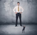 Big business bully looking at small coworker Royalty Free Stock Photo