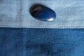 Big button on fabric in shades of blue Royalty Free Stock Photo