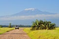 Car on amboseli national park , kilimanjaro in background Royalty Free Stock Photo