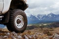 Big car wheel on background of mountains Royalty Free Stock Photo