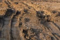 Big car wheel trace on road, puddle and mud Royalty Free Stock Photo