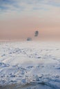 Big cargo ship in frozen ice sea fairway Royalty Free Stock Photo