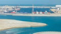 Big cargo ship at industrial port timelapse aerial view from above at evening in Abu Dhabi Royalty Free Stock Photo