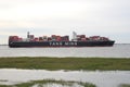 Big cargo ship yang  ming closeup in the westerschelde Royalty Free Stock Photo