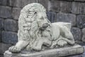 Big Cat Lion Cement Sculpture with Stone Wall Royalty Free Stock Photo