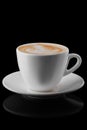Big ceramic cup of cappuccino isolated on black Royalty Free Stock Photo