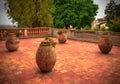 Big ceramic flowerpots on the ceramic floor, terrace Royalty Free Stock Photo