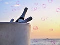 Big champagne cooler with three bottles of champagne indoors in closeup in the evening atmosphere in front of the Atlantic