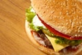 Big Cheeseburger Close up on Wooden Table Royalty Free Stock Photo