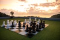 Big chess on chessboard decorated on roof with seascape at sunset Royalty Free Stock Photo