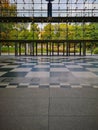 Big chessboard on the floor of Old Brewery shopping mall in front of big glassy entrance Royalty Free Stock Photo