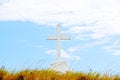 Big christian cross on a field against a blue sky Royalty Free Stock Photo