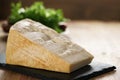 Big chunk of italian parmesan cheese on slate board Royalty Free Stock Photo