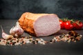 big chunk of smoked ham with spices, garlic, and tomatoes Royalty Free Stock Photo