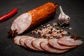 big chunk of smoked ham sausage with garlic and chili pepper Royalty Free Stock Photo