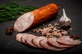 big chunk of smoked ham sausage with garlic and dill Royalty Free Stock Photo