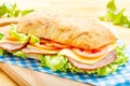 Big Ciabatta Sandwich with Bacon, Lettuce, Tomato, Cheese Royalty Free Stock Photo