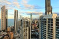 Top level living view of coastal city at sunrise