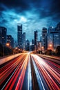 big city skyline and traffic lights blurred motion, skyscrapers and highway light trails at rush hour Royalty Free Stock Photo