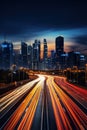 big city skyline and traffic lights blurred motion, skyscrapers and highway light trails at rush hour Royalty Free Stock Photo