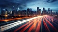 big city skyline and traffic lights blurred motion, skyscrapers and highway light trails at rush hour Royalty Free Stock Photo