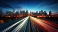 big city skyline and traffic lights blurred motion, skyscrapers and highway light trails at rush hour Royalty Free Stock Photo