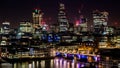 Big city towers at night with lights and reflections in the river Royalty Free Stock Photo