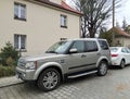 Big classic silver grey British 4WD car Landrover Discovery LR3 third generation left side and front view