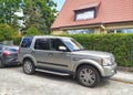 Big classic silver grey British 4WD car Landrover Discovery LR3 third generation right side and front view Royalty Free Stock Photo