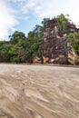 Big cliff lush jungle and sand