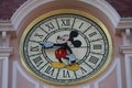 Paris, France - A big clock with Mickey Mouse on the facade of the Disneyland hotel