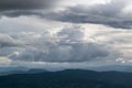 Big cloud above mountains in haze