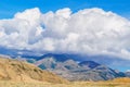 Big cloud lying on a hilltop Royalty Free Stock Photo
