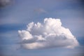 Big cloud volume figure and all shades of gray. One big cloud in the blue sky immediately after the rain, clouds in the spring sky Royalty Free Stock Photo
