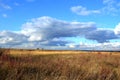 Big clouds over autumn field Royalty Free Stock Photo