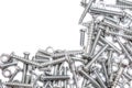 Big Collection Of Iron Screws, Wood Screws and Bolts With A Free Rectangle For Text In The Upper Left Corner Royalty Free Stock Photo
