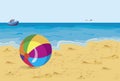 Big colorful ball on the beach seagull and ship Royalty Free Stock Photo