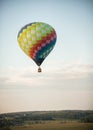 A big colorful balloon flying on a background of evening sky - using heat technology