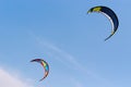 Kiteboarding kites flying in the sky.