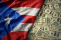 colorful waving national flag of puerto rico on a american dollar money background. finance concept Royalty Free Stock Photo