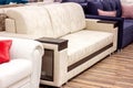 Big comfortable beige sofa in the luxury furniture store. Royalty Free Stock Photo